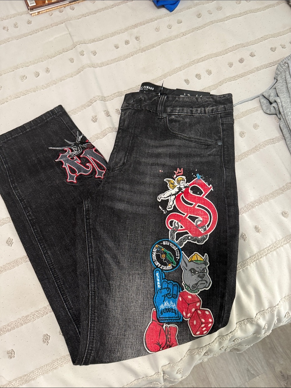 Black Graphic Patch Men’s Jeans with Red and Blue Accents